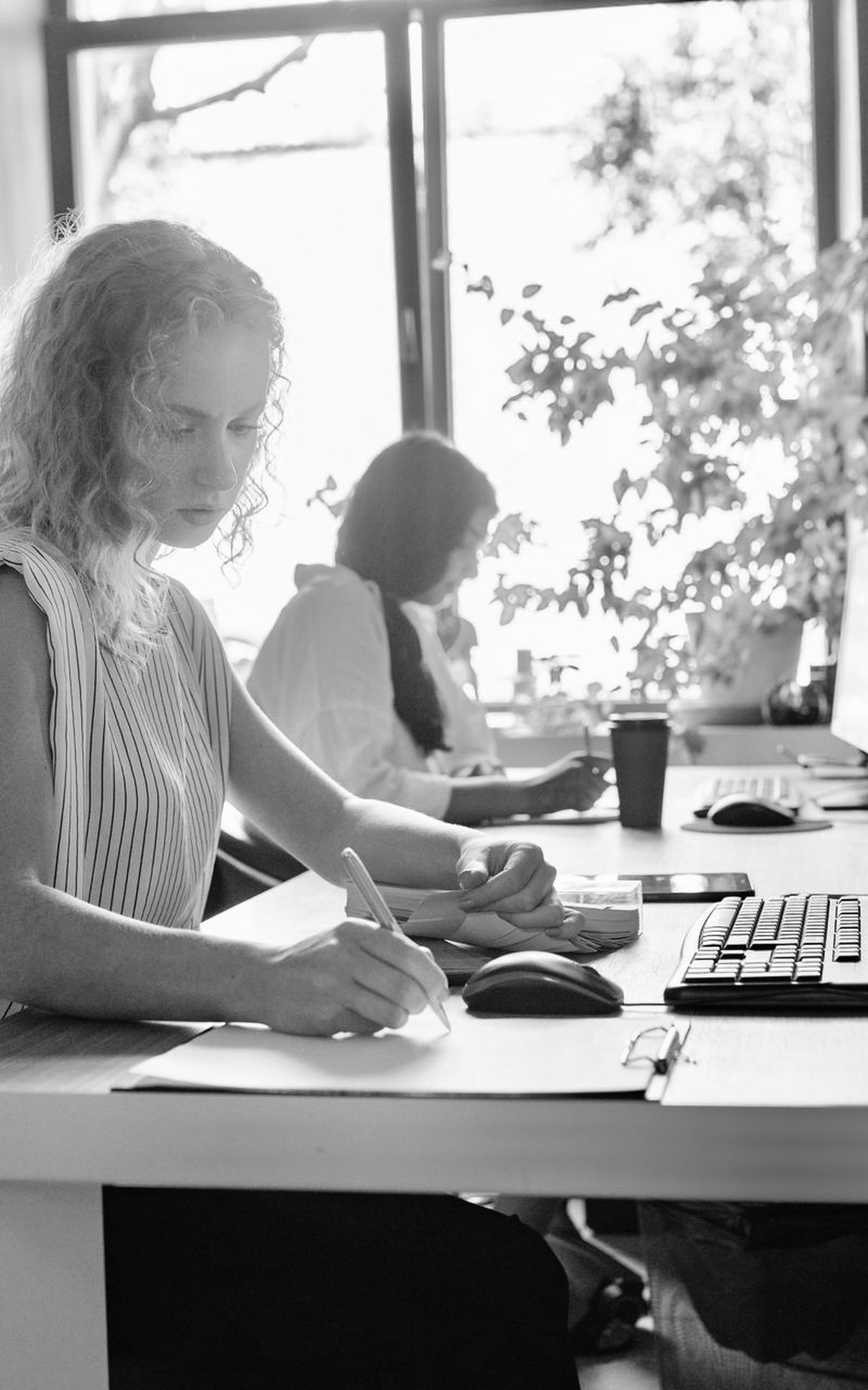 A professional working at a desk in a shared office